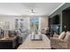 Cozy living room with plush seating, fireplace, ceiling fan, and lots of natural light at 837 Tyne Dr, Fort Mill, SC 29715