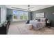 Relaxing main bedroom featuring a ceiling fan, lots of natural light and a plush rug at 837 Tyne Dr, Fort Mill, SC 29715