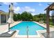 Beautiful pool with clear blue water and poolside seating, surrounded by lush greenery at 837 Tyne Dr, Fort Mill, SC 29715