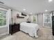 Bright bedroom featuring ample windows and neutral decor at 8527 Foxbridge Dr, Matthews, NC 28104