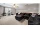 Large bonus room with sectional couch, an exercise machine, and a ceiling fan at 8527 Foxbridge Dr, Matthews, NC 28104