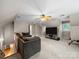 Large bonus room with a ceiling fan, tv and a sectional couch at 8527 Foxbridge Dr, Matthews, NC 28104