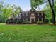 Charming brick two-story home with manicured lawn and mature landscaping at 8527 Foxbridge Dr, Matthews, NC 28104