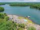 Beautiful aerial shot of waterfront condos, a pool, boat docks, and serene lake scenery at 930 Jetton St, Davidson, NC 28036