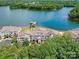 Stunning aerial view of lakeside condos surrounded by lush greenery and featuring private boat docks at 930 Jetton St, Davidson, NC 28036