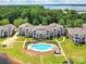Beautiful aerial shot of waterfront condos and a pool, all set against a stunning lake backdrop at 930 Jetton St, Davidson, NC 28036