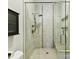 Modern walk-in shower is equipped with tiled walls, rain shower, and glass door at 930 Jetton St, Davidson, NC 28036