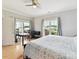 Comfortable bedroom with fan, natural light and access to a private balcony at 930 Jetton St, Davidson, NC 28036