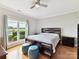 Bright bedroom showcases a ceiling fan and a large window view of the water at 930 Jetton St, Davidson, NC 28036