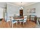 Bright dining area featuring a round table with seating and natural light, adjacent to the living area at 930 Jetton St, Davidson, NC 28036