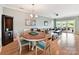 Charming dining area with a round table and chairs, next to the living room, with lots of natural light at 930 Jetton St, Davidson, NC 28036
