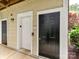 Exterior view showing an elevator, apartment entrance, and landscaping at 930 Jetton St, Davidson, NC 28036