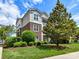Multi-story apartment building with brick and tan siding, complemented by mature landscaping and manicured lawn at 930 Jetton St, Davidson, NC 28036