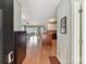 Spacious interior showcasing the kitchen island, hardwood floors and views to the outdoors from the front door at 930 Jetton St, Davidson, NC 28036