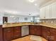 This kitchen is nicely designed with granite countertops and stainless steel appliances at 930 Jetton St, Davidson, NC 28036