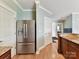Spacious kitchen features stainless steel appliances, granite countertops and wood floors at 930 Jetton St, Davidson, NC 28036