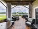 Inviting covered patio with comfortable seating and beautiful waterfront views of the community at 930 Jetton St, Davidson, NC 28036