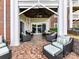Cozy outdoor patio with comfortable seating, brick flooring and ceiling fan overlooking the serene outdoors at 930 Jetton St, Davidson, NC 28036