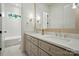 Bright bathroom featuring white cabinets, marble countertops, and modern fixtures at 9311 Simpson Rd, Waxhaw, NC 28173