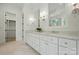 Bright bathroom with double vanity, marble countertops, and an enclosed glass shower at 9311 Simpson Rd, Waxhaw, NC 28173