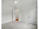 Spacious bedroom featuring neutral carpet, ceiling fan and bright natural light at 9311 Simpson Rd, Waxhaw, NC 28173