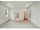 Bedroom with neutral carpeting and trim; access to the Primary bathroom and walk-in closet at 9311 Simpson Rd, Waxhaw, NC 28173
