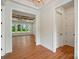 Beautiful entryway featuring hardwood floors, a ceiling fan, and a view into a bright living area at 9311 Simpson Rd, Waxhaw, NC 28173