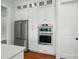 Elegant kitchen features stainless steel appliances, built-in oven, and ample storage at 9311 Simpson Rd, Waxhaw, NC 28173