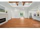 Spacious living room showcasing hardwood floors, a brick fireplace, and an open floor plan at 9311 Simpson Rd, Waxhaw, NC 28173