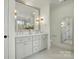 Modern bathroom with double vanity, large mirror, and stylish fixtures at 9315 Simpson Rd, Waxhaw, NC 28173