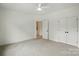 This spacious bedroom features neutral carpet, a closet, and white trim at 9315 Simpson Rd, Waxhaw, NC 28173