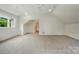 A bonus room with carpet, an angled ceiling, lots of space, and a window at 9315 Simpson Rd, Waxhaw, NC 28173