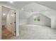 This is a bonus room with a vaulted ceiling, carpet, lots of space, and a window at 9315 Simpson Rd, Waxhaw, NC 28173