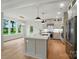 Bright kitchen with stainless appliances, island, and pendant lights at 9315 Simpson Rd, Waxhaw, NC 28173