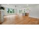 Bright living room featuring large windows and hardwood floors is the perfect entertaining space at 9315 Simpson Rd, Waxhaw, NC 28173
