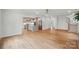 Hardwood floors connecting the living room to the kitchen and staircase at 9315 Simpson Rd, Waxhaw, NC 28173