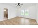 Spacious bedroom with hardwood floors, bright walls, and a connected bathroom at 1011 Sandy Ct, Gastonia, NC 28056