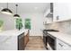 Modern kitchen featuring stainless appliances, center island with sink, and plenty of countertop space at 1011 Sandy Ct, Gastonia, NC 28056