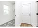 Well-lit laundry room with decorative tile flooring and ample storage at 1011 Sandy Ct, Gastonia, NC 28056