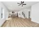 Inviting open-concept living and kitchen area with hardwood floors and natural light from many windows at 1011 Sandy Ct, Gastonia, NC 28056
