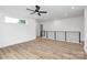 Bright and airy loft area with hardwood floors, a ceiling fan, and modern railing at 1011 Sandy Ct, Gastonia, NC 28056
