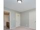 Neutral bedroom with a view to en suite bathroom and closet with double doors at 10515 Greenhead View Rd, Charlotte, NC 28262