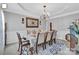 Elegant dining room featuring a chandelier, decorative rug, and seating for eight at 10515 Greenhead View Rd, Charlotte, NC 28262