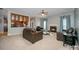 Open-concept living room with fireplace, bar area, and comfortable seating at 10515 Greenhead View Rd, Charlotte, NC 28262