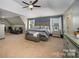 Spacious main bedroom features a sitting area and a king-sized bed at 10515 Greenhead View Rd, Charlotte, NC 28262