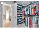 Large walk-in closet with custom shelving and hanging rods at 10515 Greenhead View Rd, Charlotte, NC 28262