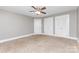 Bedroom with carpet, ceiling fan and two closets at 1103 Oklahoma St, Kannapolis, NC 28083