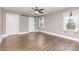 Spacious bedroom with wood floors, neutral paint and a barn door leading into another room at 1103 Oklahoma St, Kannapolis, NC 28083