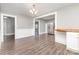 Dining room featuring hardwood floors, neutral gray paint, and open access to stainless appliances at 1103 Oklahoma St, Kannapolis, NC 28083