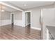 Open dining room with white wainscoting details and view of the refrigerator in the kitchen at 1103 Oklahoma St, Kannapolis, NC 28083